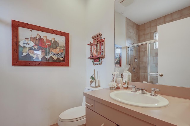 bathroom with vanity, toilet, and walk in shower