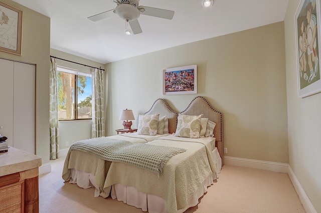 carpeted bedroom featuring ceiling fan