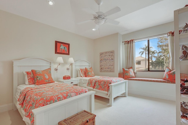 bedroom featuring ceiling fan and light colored carpet