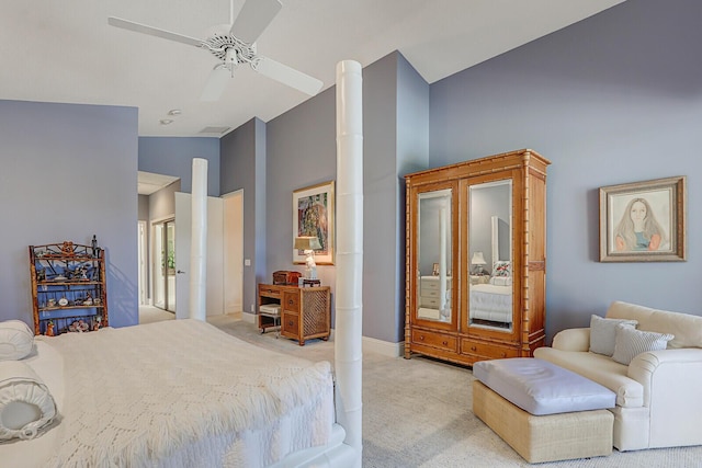 bedroom featuring light carpet, vaulted ceiling, and ceiling fan