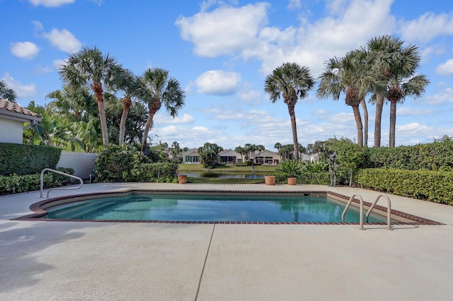 view of swimming pool with a patio area