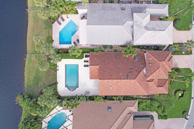 birds eye view of property featuring a water view