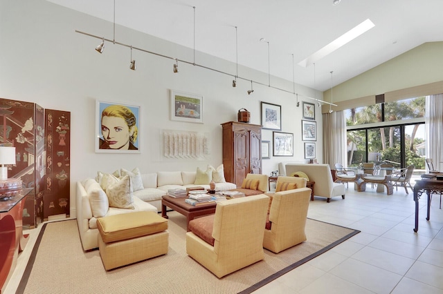 living room featuring light tile patterned floors, high vaulted ceiling, and rail lighting