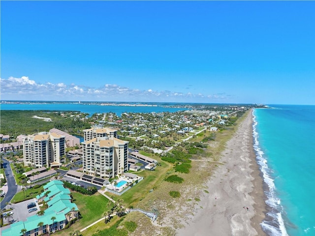 drone / aerial view with a view of the beach and a water view