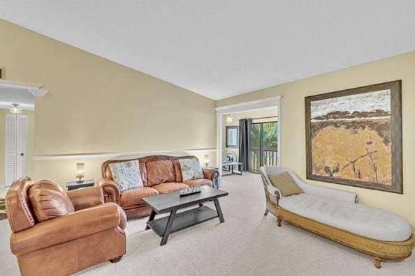 living room featuring light carpet and vaulted ceiling