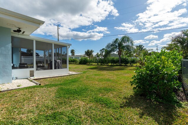 view of yard with a sunroom