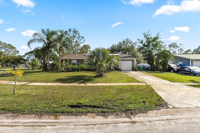 view of front of property featuring a front yard and a garage