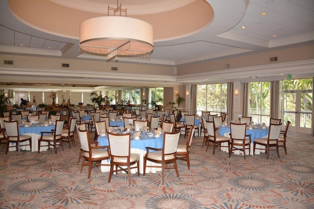 dining space featuring a high ceiling, ornamental molding, and coffered ceiling