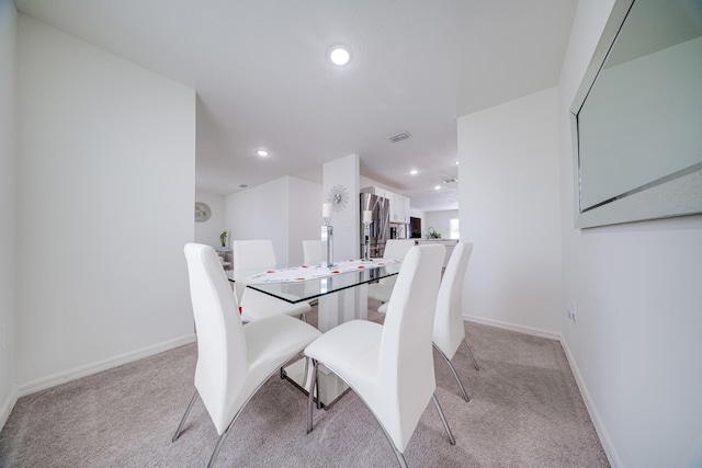 view of carpeted dining space