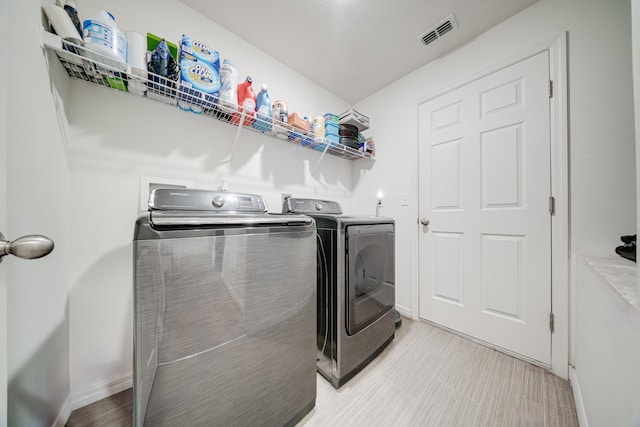 washroom featuring separate washer and dryer