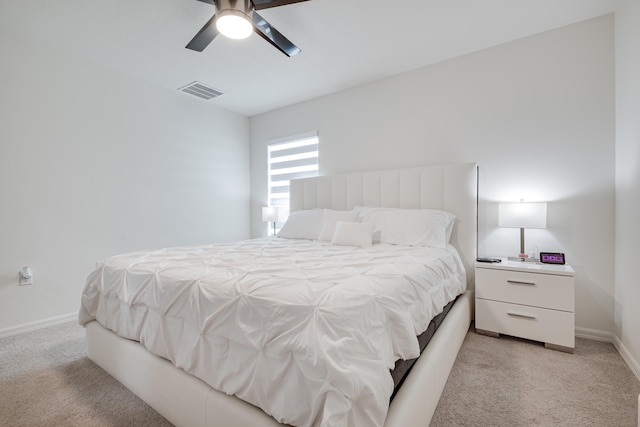 bedroom featuring light colored carpet and ceiling fan