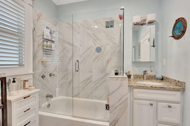 bathroom with vanity and enclosed tub / shower combo