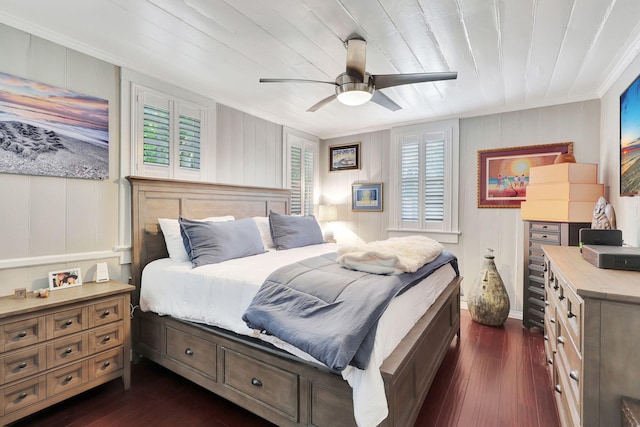 bedroom with multiple windows, ceiling fan, dark wood-type flooring, and wood ceiling