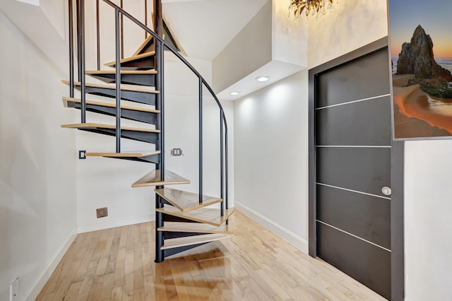 stairs with wood-type flooring