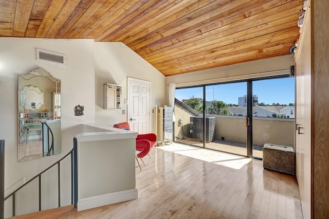 interior space featuring vaulted ceiling, wood ceiling, and light hardwood / wood-style floors