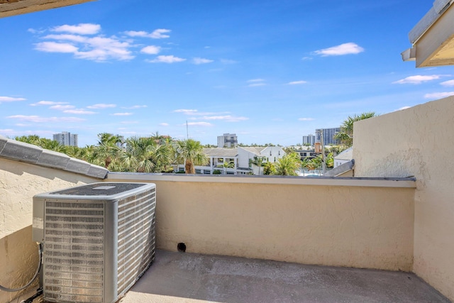 view of patio / terrace featuring central AC unit and a balcony