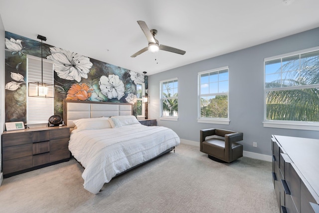 bedroom featuring ceiling fan and light colored carpet