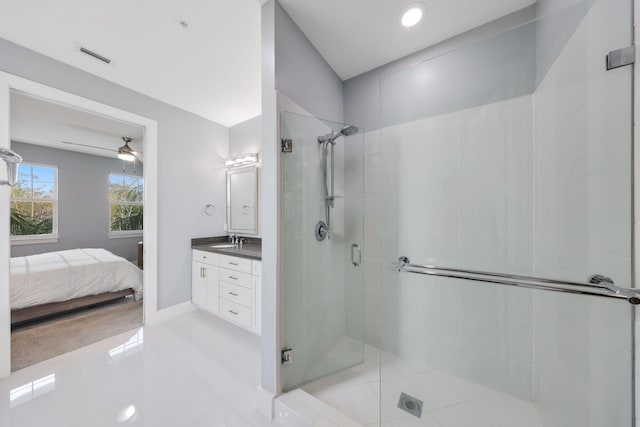 bathroom featuring tile patterned floors, vanity, ceiling fan, and an enclosed shower