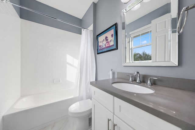 full bathroom featuring vanity, shower / bath combination with curtain, and toilet