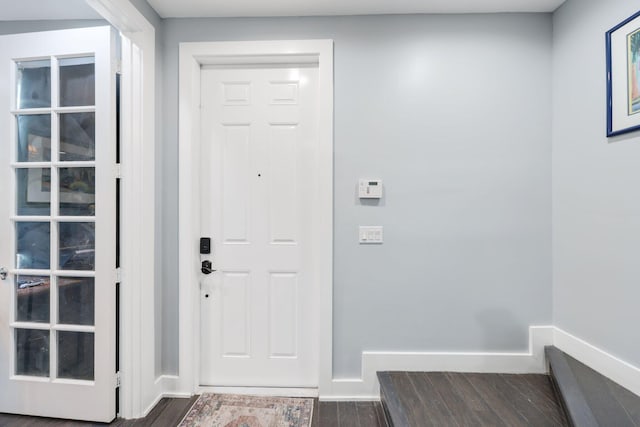 foyer featuring dark wood-type flooring