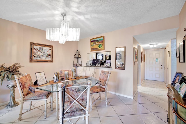 tiled dining space featuring a textured ceiling and an inviting chandelier