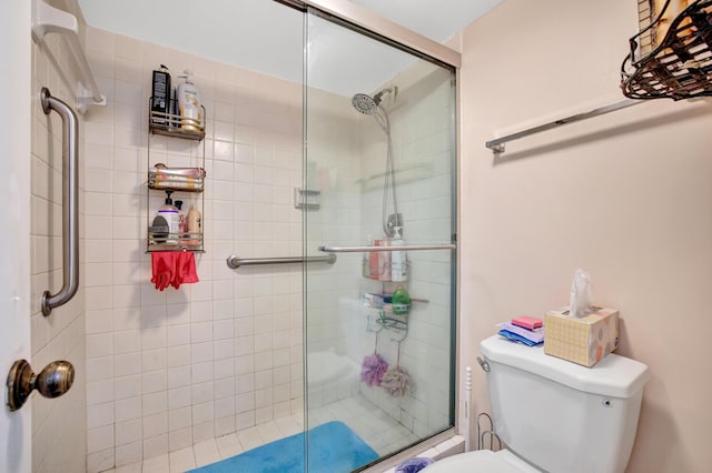 bathroom with toilet and walk in shower