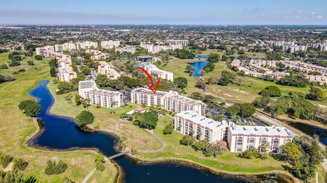 birds eye view of property featuring a water view