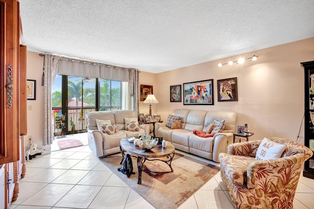 tiled living room featuring a textured ceiling