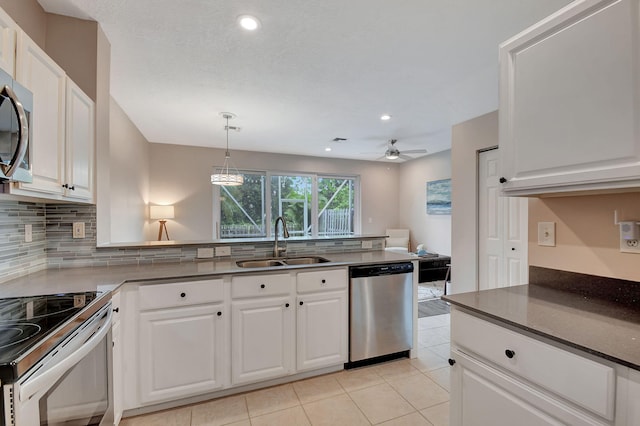 kitchen with white cabinetry, sink, and appliances with stainless steel finishes