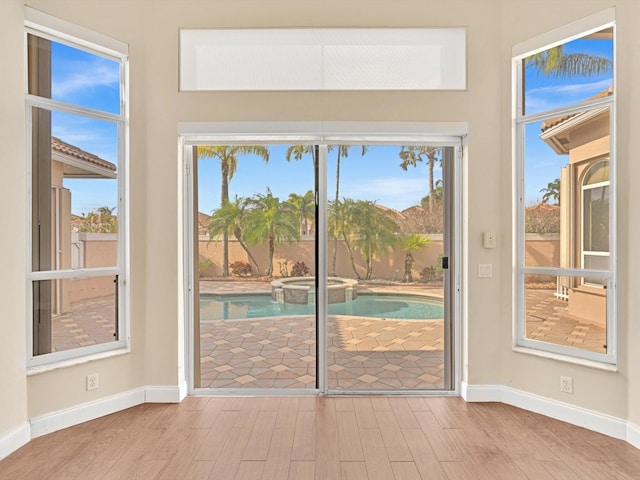 doorway to outside with hardwood / wood-style flooring
