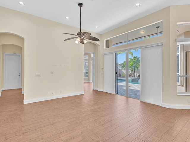 empty room featuring light hardwood / wood-style flooring and ceiling fan