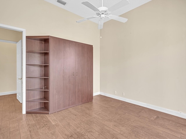 unfurnished bedroom with light hardwood / wood-style flooring and ceiling fan