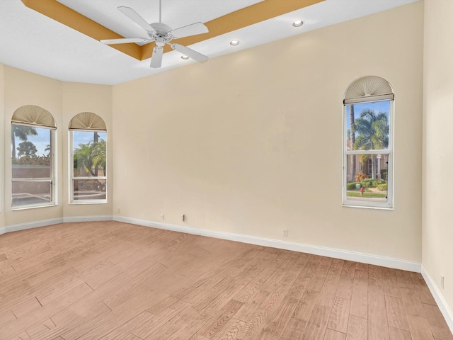 unfurnished room with light hardwood / wood-style floors and ceiling fan