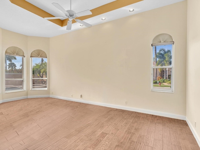 spare room with ceiling fan and light hardwood / wood-style flooring