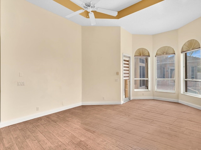 unfurnished room with ceiling fan and light hardwood / wood-style floors