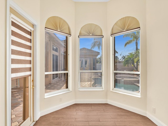 unfurnished sunroom featuring a healthy amount of sunlight