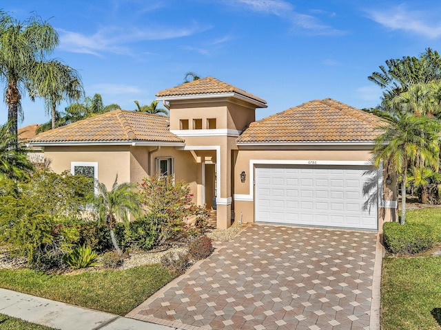 mediterranean / spanish-style house featuring a garage