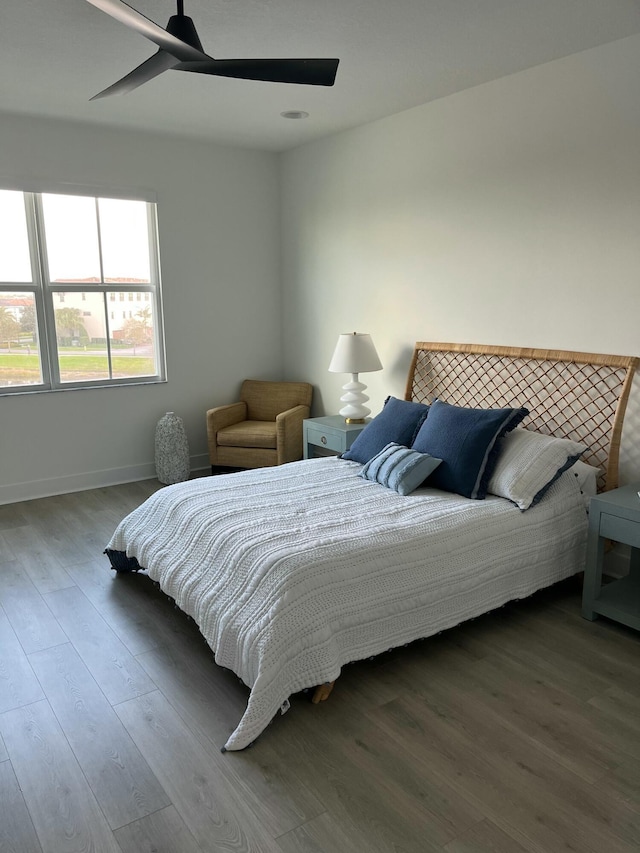 bedroom featuring hardwood / wood-style floors and ceiling fan