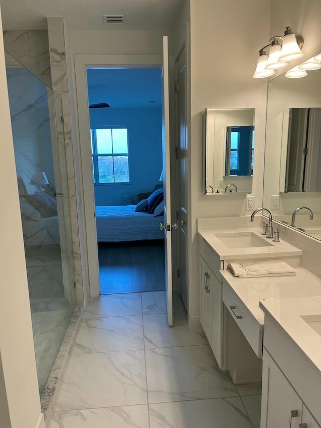 bathroom featuring vanity and tiled shower