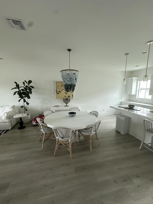 unfurnished dining area with wood-type flooring