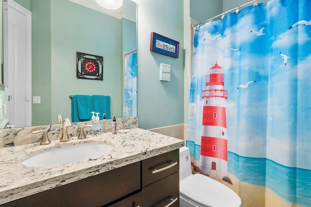 bathroom with vanity, toilet, and curtained shower