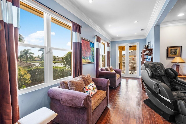 living room with french doors, dark hardwood / wood-style floors, ornamental molding, and a healthy amount of sunlight