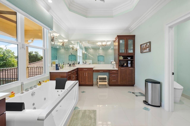 bathroom featuring vanity, an inviting chandelier, tile patterned floors, a raised ceiling, and crown molding