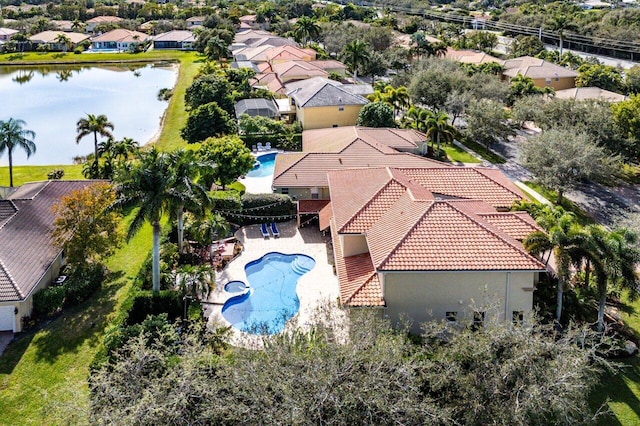 drone / aerial view with a water view