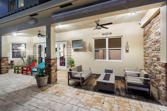 view of patio / terrace featuring a fire pit and ceiling fan