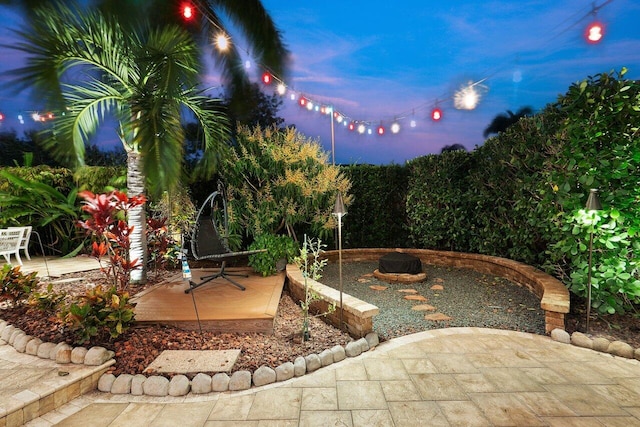 view of patio terrace at dusk