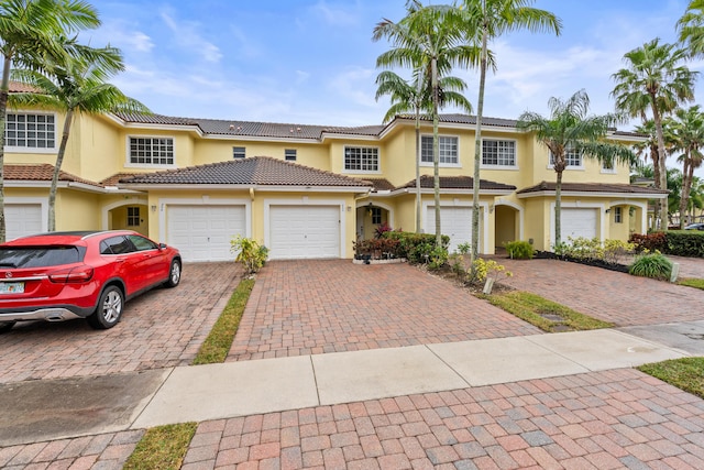 view of front of property with a garage