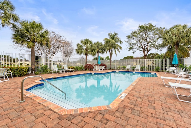 view of swimming pool with a patio