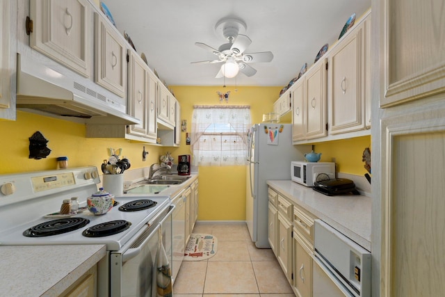 kitchen with ceiling fan, light tile patterned flooring, white appliances, and sink