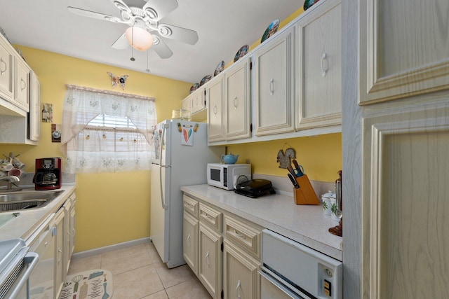 kitchen with light tile patterned flooring, white appliances, ceiling fan, and sink